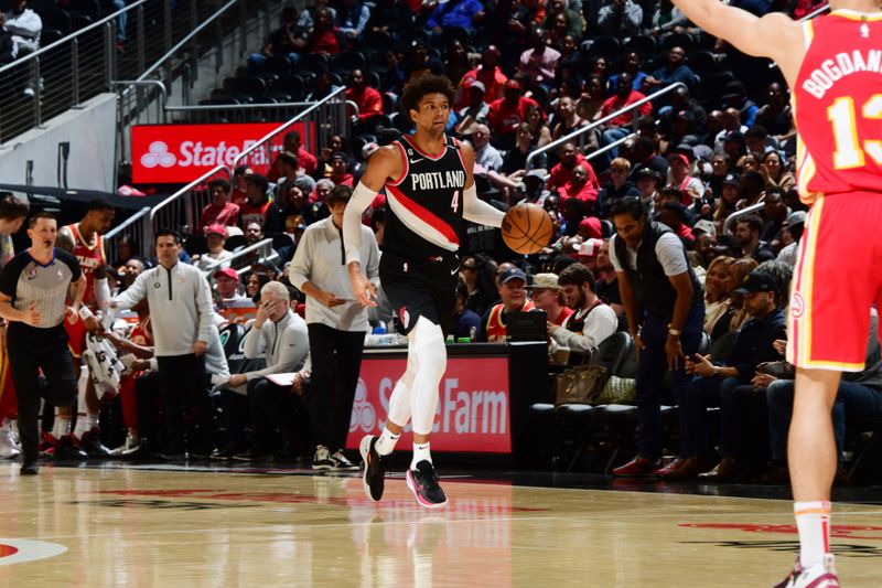 ATLANTA, GA - MARCH 3: Matisse Thybulle #4 of the Portland Trail Blazers dribbles the ball during the game against the Atlanta Hawks on March 3, 2023 at State Farm Arena in Atlanta, Georgia.  NOTE TO USER: User expressly acknowledges and agrees that, by downloading and/or using this Photograph, user is consenting to the terms and conditions of the Getty Images License Agreement. Mandatory Copyright Notice: Copyright 2023 NBAE (Photo by Scott Cunningham/NBAE via Getty Images)