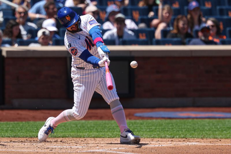 May 11, 2025; New York City, New York, USA; New York Mets catcher Luis Torrens (13) hits an RBI triple during the second inning against the Chicago Cubs  at Citi Field. Mandatory Credit: Vincent Carchietta-Imagn Images