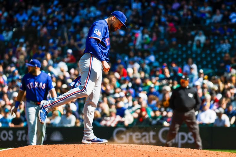 Apr 13, 2025; Seattle, Washington, USA; Texas Rangers pitcher Nathan Eovaldi (17) kicks at the dirt on the mound shortly before being relieved for against the Seattle Mariners during the sixth inning at T-Mobile Park. Mandatory Credit: Joe Nicholson-Imagn Images