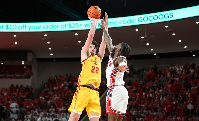 Feb 19, 2024; Houston, Texas, USA; Iowa State Cyclones forward Milan Momcilovic (22) shoots the ball over Houston Cougars guard Jamal Shead (1) during the first half at Fertitta Center. Mandatory Credit: Troy Taormina-USA TODAY Sports