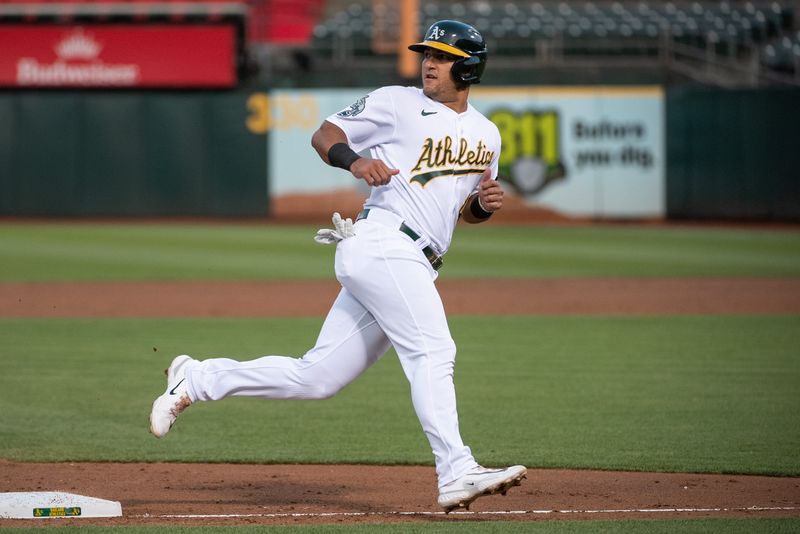 Aug 22, 2023; Oakland, California, USA; Oakland Athletics catcher Carlos Perez (44) looks back as he rounds third base on his way to score during the third inning against the Kansas City Royals at Oakland-Alameda County Coliseum. Mandatory Credit: Ed Szczepanski-USA TODAY Sports