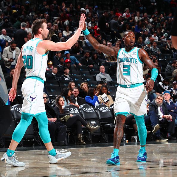 BROOKLYN, NY - NOVEMBER 30: Gordon Hayward #20 high fives Terry Rozier #3 of the Charlotte Hornets during the game against the Brooklyn Nets on November 30, 2023 at Barclays Center in Brooklyn, New York. NOTE TO USER: User expressly acknowledges and agrees that, by downloading and or using this Photograph, user is consenting to the terms and conditions of the Getty Images License Agreement. Mandatory Copyright Notice: Copyright 2023 NBAE (Photo by David L. Nemec/NBAE via Getty Images)