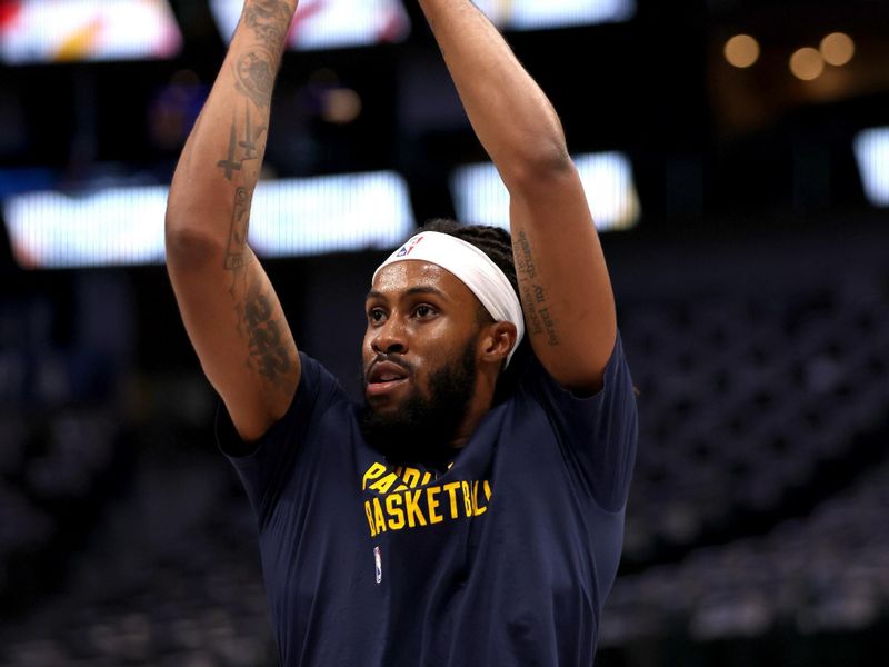 DALLAS, TEXAS - MARCH 05: Isaiah Jackson #22 of the Indiana Pacers takes a shot during warmups before the game against the Dallas Mavericks at American Airlines Center on March 05, 2024 in Dallas, Texas. NOTE TO USER: User expressly acknowledges and agrees that, by downloading and or using this photograph, User is consenting to the terms and conditions of the Getty Images License Agreement. (Photo by Tim Heitman/Getty Images)