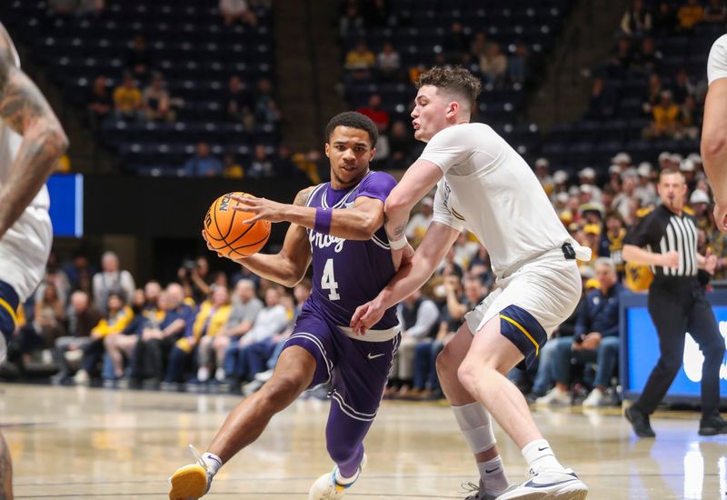 Mar 6, 2024; Morgantown, West Virginia, USA; TCU Horned Frogs guard Jameer Nelson Jr. (4) drives against West Virginia Mountaineers forward Quinn Slazinski (11) during the first half at WVU Coliseum. Mandatory Credit: Ben Queen-USA TODAY Sports