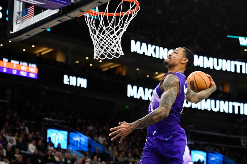 SALT LAKE CITY, UTAH - DECEMBER 13: John Collins #20 of the Utah Jazz dunks during the first half of a game against the Phoenix Suns at Delta Center on December 13, 2024 in Salt Lake City, Utah.  NOTE TO USER: User expressly acknowledges and agrees that, by downloading and or using this photograph, User is consenting to the terms and conditions of the Getty Images License Agreement. (Photo by Alex Goodlett/Getty Images)