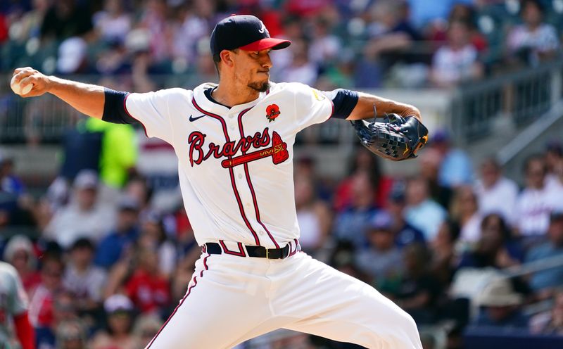 May 27, 2024; Cumberland, Georgia, USA; Atlanta Braves pitcher Charlie Morton (50) pitching against the Washington Nationals during the second inning at Truist Park. Mandatory Credit: John David Mercer-USA TODAY Sports