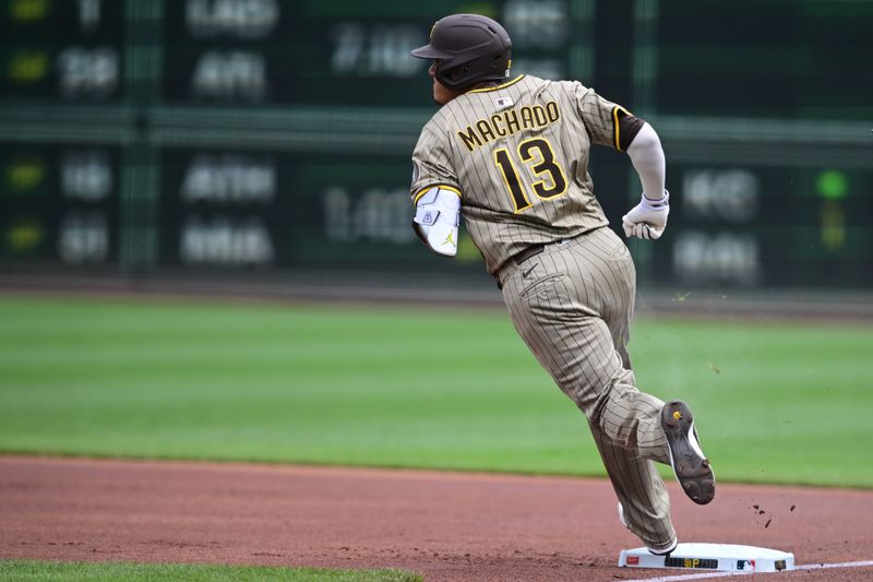 May 4, 2025; Pittsburgh, Pennsylvania, USA; San Diego Padres third baseman Manny Machado (13) runs to second base after hitting a double during the first inning against the Pittsburgh Pirates at PNC Park. Mandatory Credit: David Dermer-Imagn Images
