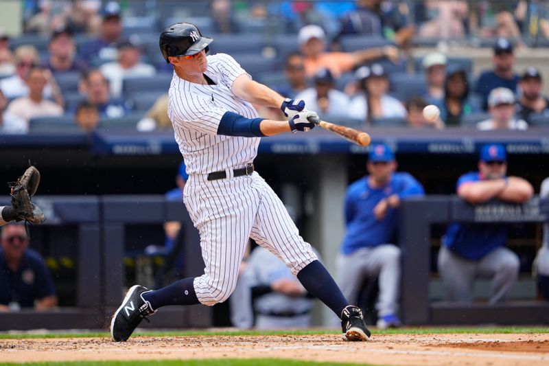 Jul 8, 2023; Bronx, New York, USA; New York Yankees third baseman DJ LeMahieu (26) hits a double against the Chicago Cubs during the second inning at Yankee Stadium. Mandatory Credit: Gregory Fisher-USA TODAY Sports