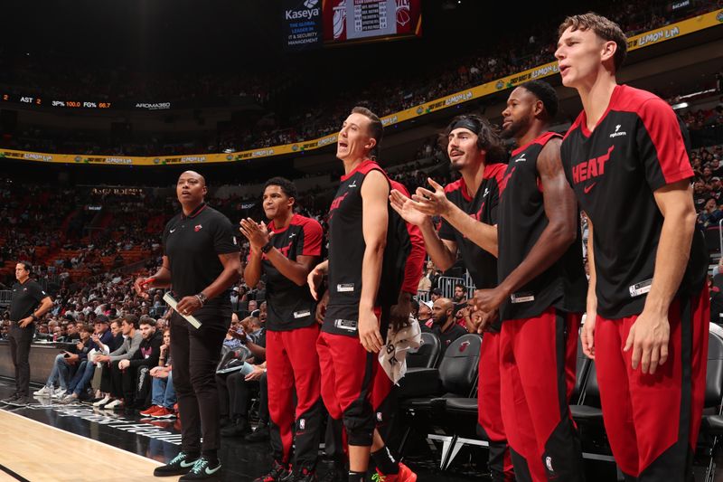 MIAMI, FL - OCTOBER 30: Miami Heat bench celebrates during the game against the New York Knicks on October 30, 2024 at Kaseya Center in Miami, Florida. NOTE TO USER: User expressly acknowledges and agrees that, by downloading and or using this Photograph, user is consenting to the terms and conditions of the Getty Images License Agreement. Mandatory Copyright Notice: Copyright 2024 NBAE (Photo by Issac Baldizon/NBAE via Getty Images)