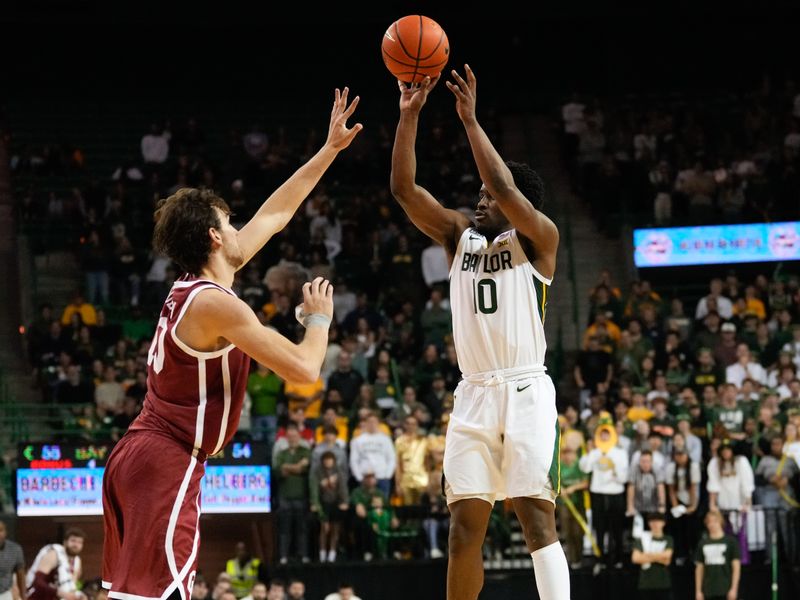 Feb 8, 2023; Waco, Texas, USA;  Baylor Bears guard Adam Flagler (10) scores a basket over Oklahoma Sooners forward Sam Godwin (10) during the second half at Ferrell Center. Mandatory Credit: Chris Jones-USA TODAY Sports