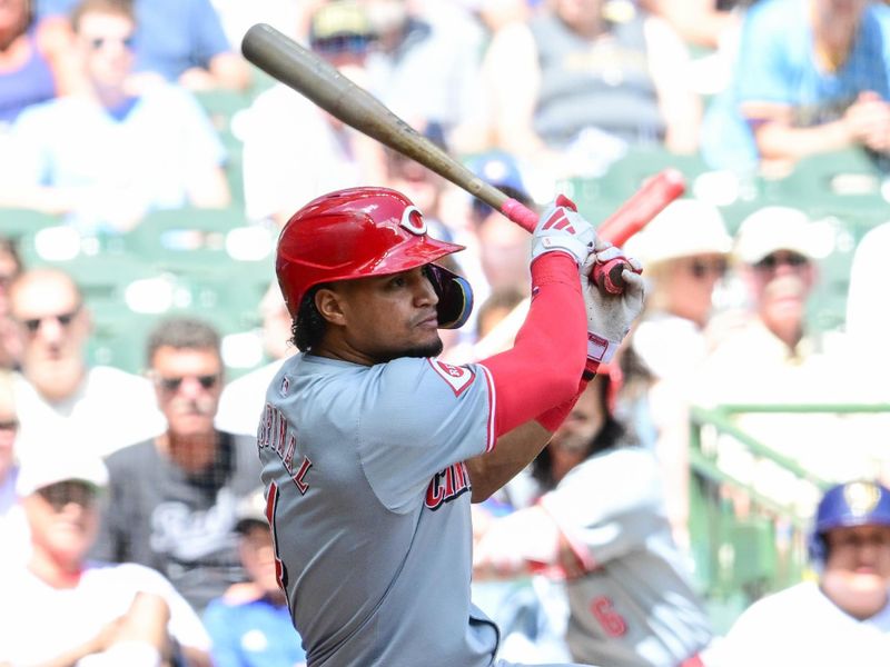 Aug 11, 2024; Milwaukee, Wisconsin, USA; Cincinnati Reds second baseman Santiago Espinal (4) hits a single to drive in two runs in the fourth inning against the Milwaukee Brewers at American Family Field. Mandatory Credit: Benny Sieu-USA TODAY Sports