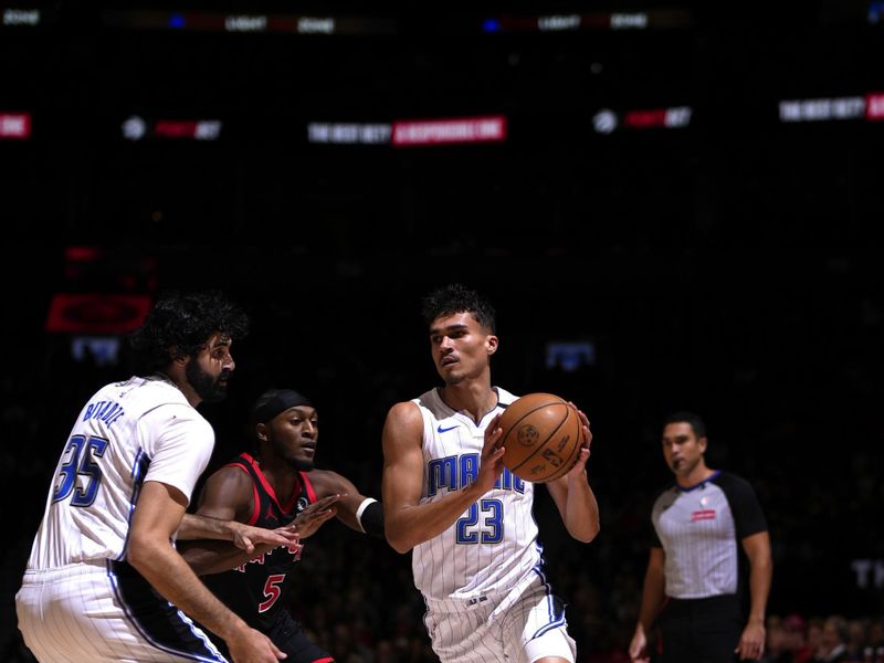 TORONTO, CANADA - JANUARY 3: Tristan da Silva #23 of the Orlando Magic handles the ball during the game against the Toronto Raptors on January 3, 2025 at the Scotiabank Arena in Toronto, Ontario, Canada.  NOTE TO USER: User expressly acknowledges and agrees that, by downloading and or using this Photograph, user is consenting to the terms and conditions of the Getty Images License Agreement.  Mandatory Copyright Notice: Copyright 2025 NBAE(Photo by Mark Blinch/NBAE via Getty Images)