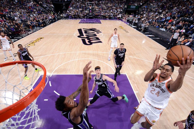 SACRAMENTO, CA - FEBRUARY 22: Devin Vassell #24 of the San Antonio Spurs drives to the basket during the game against the Sacramento Kings on February 22, 2024 at Golden 1 Center in Sacramento, California. NOTE TO USER: User expressly acknowledges and agrees that, by downloading and or using this Photograph, user is consenting to the terms and conditions of the Getty Images License Agreement. Mandatory Copyright Notice: Copyright 2023 NBAE (Photo by Rocky Widner/NBAE via Getty Images)