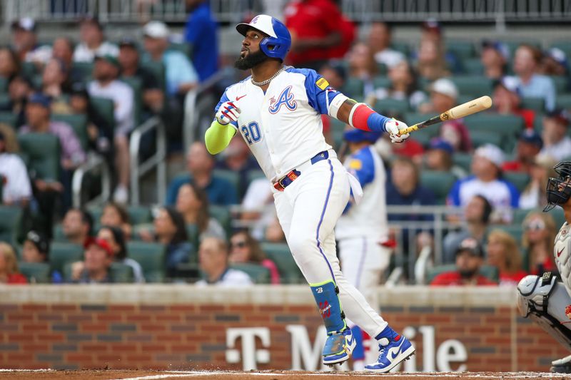 Apr 27, 2024; Atlanta, Georgia, USA; Atlanta Braves designated hitter Marcell Ozuna (20) hits a double against the Cleveland Guardians in the second inning at Truist Park. Mandatory Credit: Brett Davis-USA TODAY Sports