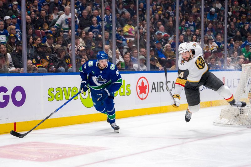 Apr 8, 2024; Vancouver, British Columbia, CAN; Vegas Golden Knights defenseman Nicolas Hague (14) loses an edge after being deked by Vancouver Canucks forward Nils Aman (88) in the third period at Rogers Arena. Canucks won 4 -3. Mandatory Credit: Bob Frid-USA TODAY Sports