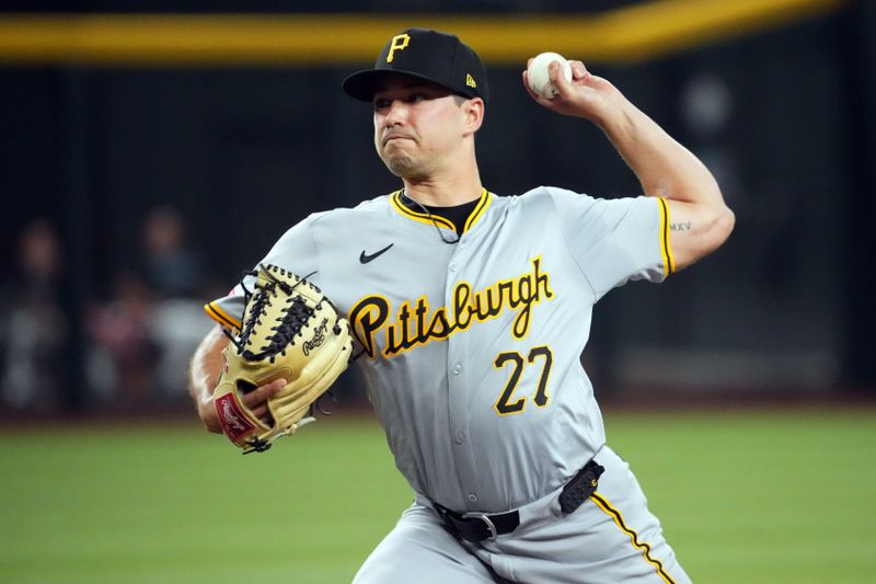 Jul 27, 2024; Phoenix, Arizona, USA; Pittsburgh Pirates pitcher Marco Gonzales (27) pitches against the Arizona Diamondbacks during the first inning at Chase Field. Mandatory Credit: Joe Camporeale-USA TODAY Sports