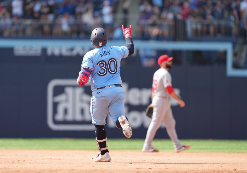 Aug 25, 2024; Toronto, Ontario, CAN; Toronto Blue Jays catcher Alejandro Kirk (30) celebrates after hitting a two run home run against the Los Angeles Angels during the seventh inning at Rogers Centre. Mandatory Credit: Nick Turchiaro-USA TODAY Sports