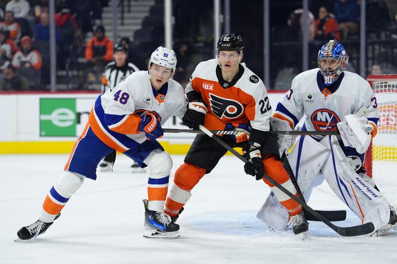 Jan 26, 2026; Philadelphia, Pennsylvania, USA; New York Islanders defenseman Matthew Schaefer (48) and Philadelphia Flyers center Christian Dvorak (22) battle for position in the third period at Xfinity Mobile Arena. Mandatory Credit: Kyle Ross-Imagn Images
