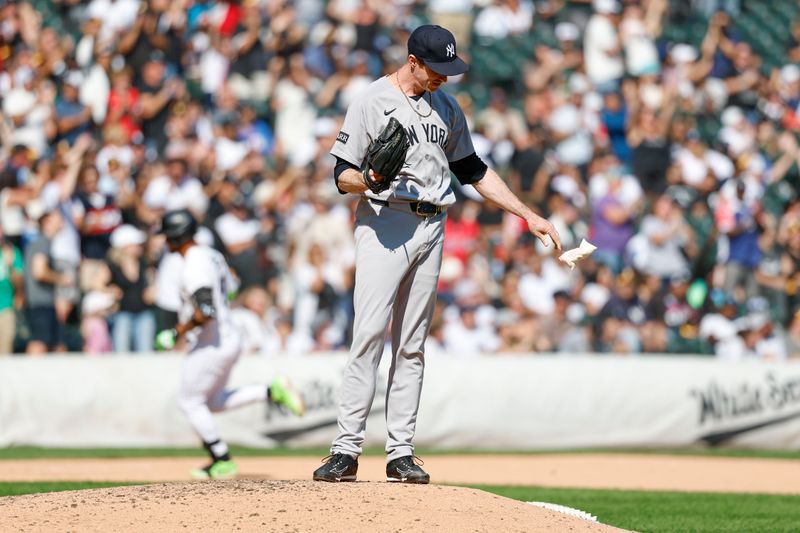 Aug 31, 2025; Chicago, Illinois, USA; New York Yankees relief pitcher Tim Hill (41) reacts after giving up a solo home run to Chicago White Sox first baseman Lenyn Sosa (50) during the eight inning at Rate Field. Mandatory Credit: Kamil Krzaczynski-Imagn Images