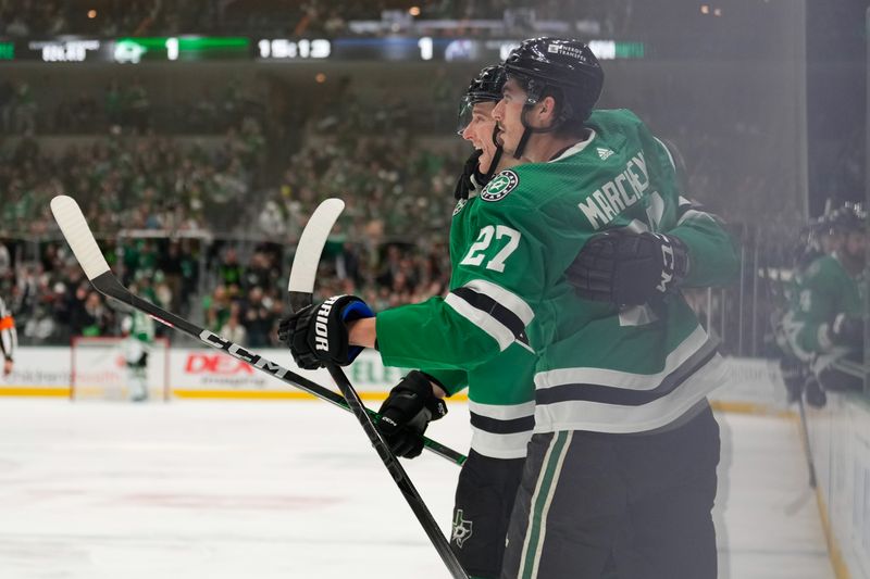 Feb 17, 2024; Dallas, Texas, USA; Dallas Stars defenseman Thomas Harley (55) celebrates with left wing Mason Marchment (27) after scoring a goal against the Edmonton Oilers during the second period at American Airlines Center. Mandatory Credit: Chris Jones-USA TODAY Sports