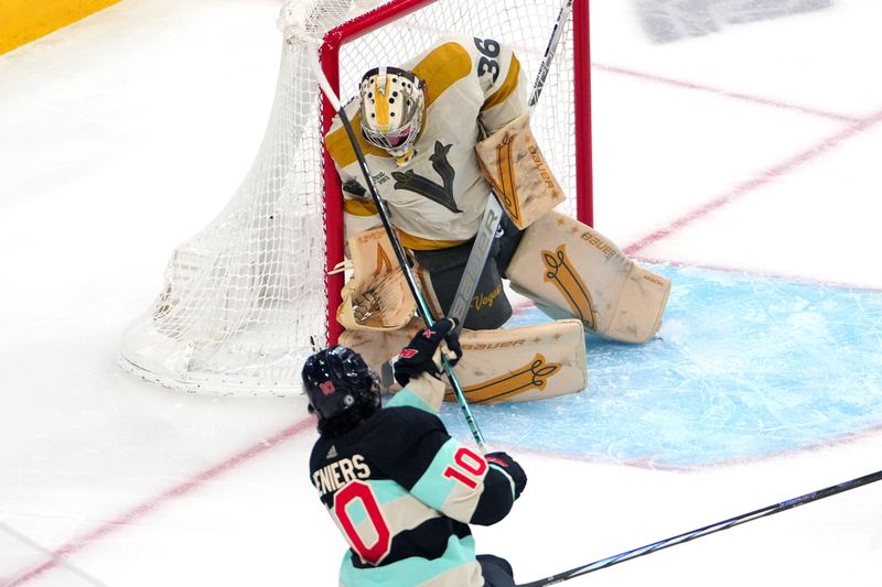 Mar 21, 2024; Las Vegas, Nevada, USA; Vegas Golden Knights goaltender Logan Thompson (36) makes a save against Seattle Kraken center Matty Beniers (10) during the first period at T-Mobile Arena. Mandatory Credit: Stephen R. Sylvanie-USA TODAY Sports