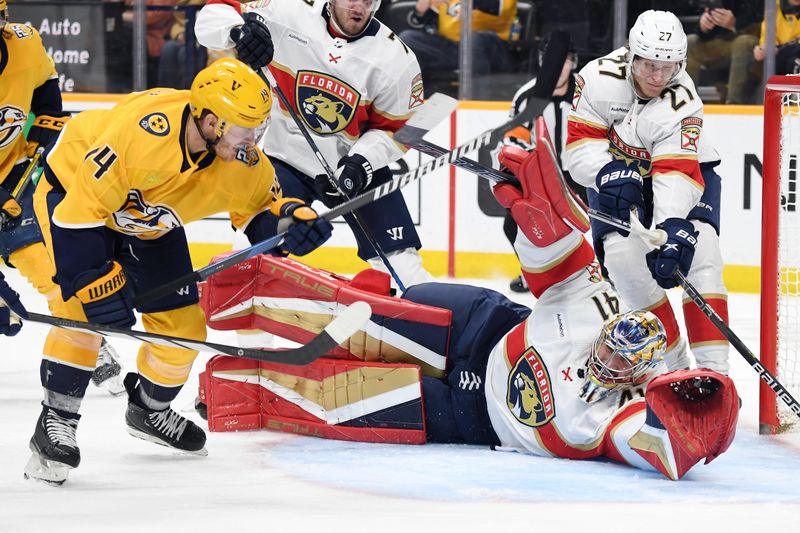 Jan 22, 2024; Nashville, Tennessee, USA; Florida Panthers goaltender Anthony Stolarz (41) makes a save on a shot by Nashville Predators center Gustav Nyquist (14) during the third period at Bridgestone Arena. Mandatory Credit: Christopher Hanewinckel-USA TODAY Sports