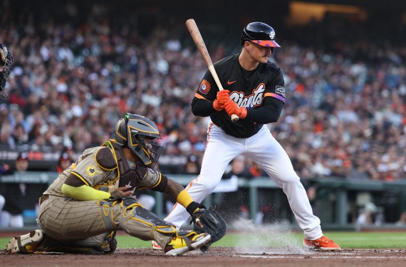 Jun 3, 2025; San Francisco, California, USA; A low pitch bounces of the ground with San Francisco Giants third baseman Matt Chapman (26) at bat ahead of San Diego Padres catcher Martin Maldonado (15) during the third inning at Oracle Park. Mandatory Credit: Kelley L Cox-Imagn Images