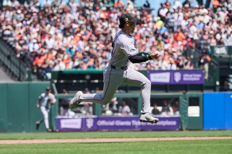 May 19, 2024; San Francisco, California, USA; Colorado Rockies infielder Ryan McMahon (24) jumps with the ball against the San Francisco Giants during the fifth inning at Oracle Park. Mandatory Credit: Robert Edwards-USA TODAY Sports