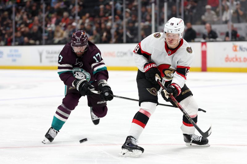 Mar 6, 2024; Anaheim, California, USA;  Ottawa Senators center Tim Stutzle (18) receives a pass in front of Anaheim Ducks left wing Alex Killorn (17) during the third period at Honda Center. Mandatory Credit: Kiyoshi Mio-USA TODAY Sports