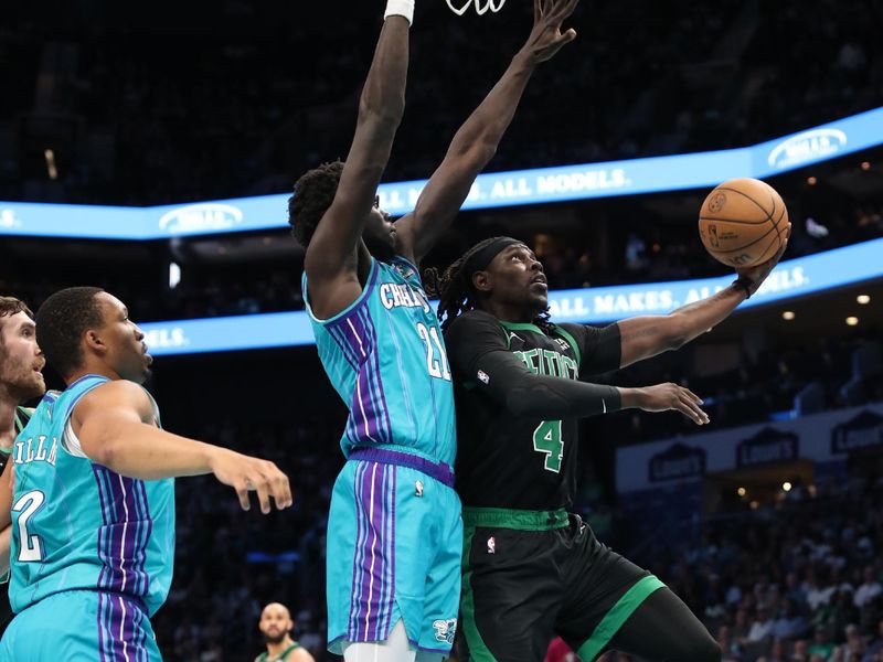 CHARLOTTE, NC - APRIL 1: Jrue Holiday #4 of the Boston Celtics drives to the basket during the game against the Charlotte Hornets on April 1, 2024 at Spectrum Center in Charlotte, North Carolina. NOTE TO USER: User expressly acknowledges and agrees that, by downloading and or using this photograph, User is consenting to the terms and conditions of the Getty Images License Agreement.  Mandatory Copyright Notice:  Copyright 2024 NBAE (Photo by Brock Williams-Smith/NBAE via Getty Images)