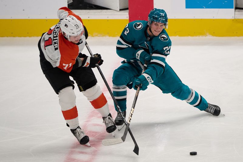 Nov 7, 2023; San Jose, California, USA; San Jose Sharks center William Eklund (72) battles for control of the puck against Philadelphia Flyers right wing Tyson Foerster (71) during the third period at SAP Center at San Jose. Mandatory Credit: Robert Edwards-USA TODAY Sports