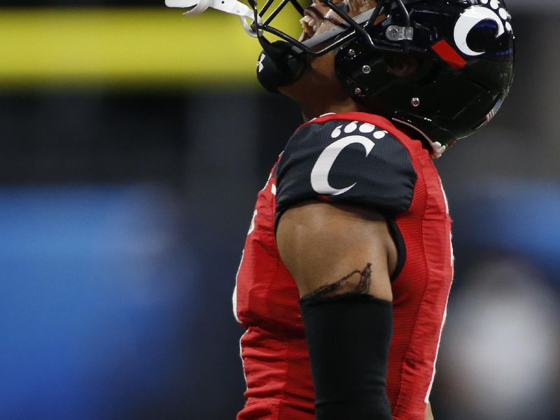 Jan 1, 2021; Atlanta, GA, USA; Cincinnati corner back Coby Bryant (7) celebrates after a turnover during the second half of the Peach Bowl NCAA college football game between Georgia and Cincinnati at Mercedes-Benz Stadium in Atlanta., on Friday, Jan. 1, 2021.  Georgia won 24-21. Mandatory Credit: Joshua L. Jones-USA TODAY NETWORK