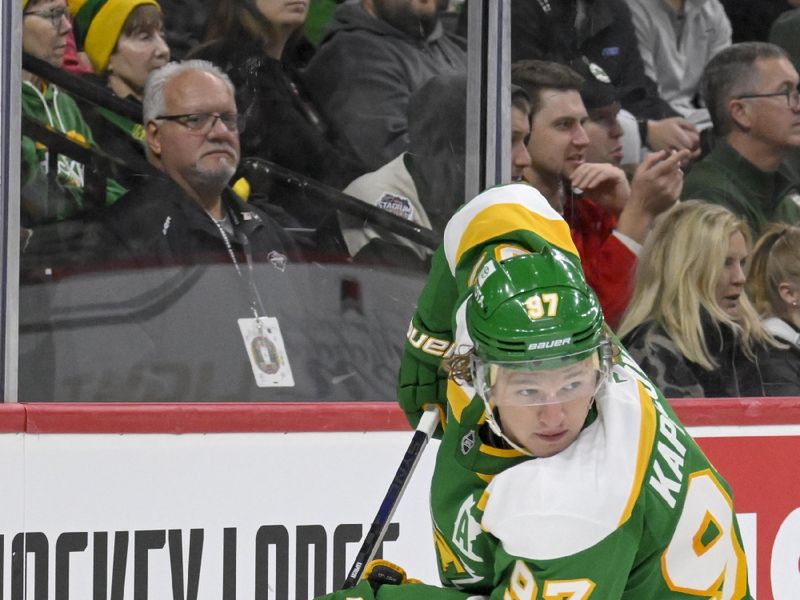 Nov 29, 2024; Saint Paul, Minnesota, USA;  Minnesota Wild forward Kirill Kaprizov (97) controls the puck against the Chicago Blackhawks during the second period at Xcel Energy Center. Mandatory Credit: Nick Wosika-Imagn Images