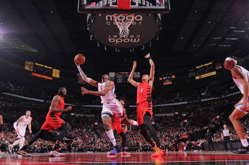 PORTLAND, OR - JANUARY 26: Jalen Williams #8 of the Oklahoma City Thunder drives to the basket during the game against the Portland Trail Blazers on January 26, 2025 at the Moda Center Arena in Portland, Oregon. NOTE TO USER: User expressly acknowledges and agrees that, by downloading and or using this photograph, user is consenting to the terms and conditions of the Getty Images License Agreement. Mandatory Copyright Notice: Copyright 2025 NBAE (Photo by Cameron Browne/NBAE via Getty Images)