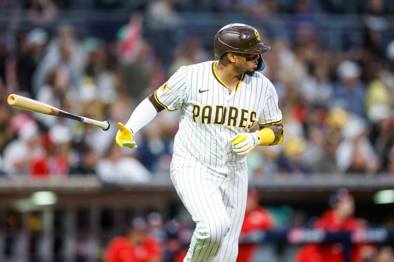 Jun 24, 2025; San Diego, California, USA; San Diego Padres catcher Martin Maldonado (15) flips his bat after hitting a one-run home run during the fifth inning against the Washington Nationals at Petco Park. Mandatory Credit: David Frerker-Imagn Images
