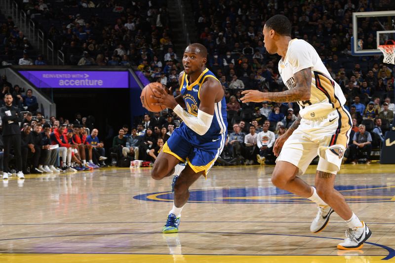 SAN FRANCISCO, CA - OCTOBER 30: Jonathan Kuminga #00 of the Golden State Warriors handles the ball during the game against the New Orleans Pelicans on October 30, 2024 at Chase Center in San Francisco, California. NOTE TO USER: User expressly acknowledges and agrees that, by downloading and or using this photograph, user is consenting to the terms and conditions of Getty Images License Agreement. Mandatory Copyright Notice: Copyright 2024 NBAE (Photo by Noah Graham/NBAE via Getty Images)