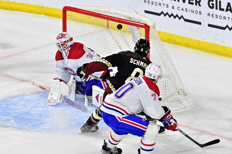 Nov 2, 2023; Tempe, Arizona, USA;  Arizona Coyotes center Nick Schmaltz (8) scores on Montreal Canadiens goaltender Jake Allen (34) as left wing Tanner Pearson (70) watches in the third period at Mullett Arena. Mandatory Credit: Matt Kartozian-USA TODAY Sports