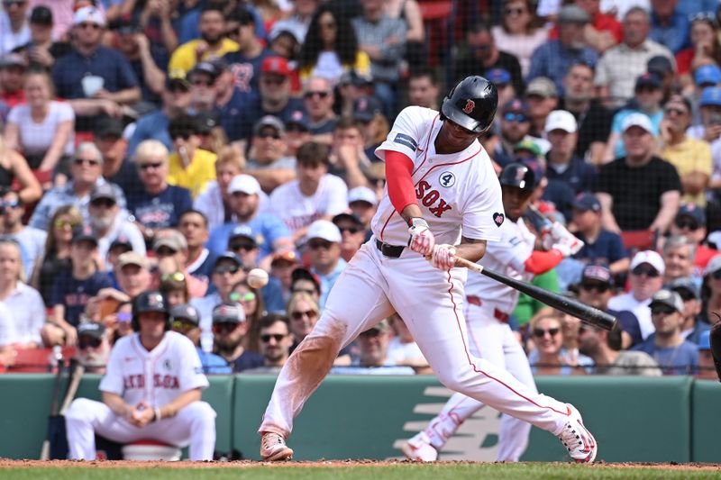 Jun 2, 2024; Boston, Massachusetts, USA;  Boston Red Sox third baseman Rafael Devers (11) hits a home run against the Detroit Tigers during the eighth inning at Fenway Park. Mandatory Credit: Eric Canha-USA TODAY Sports