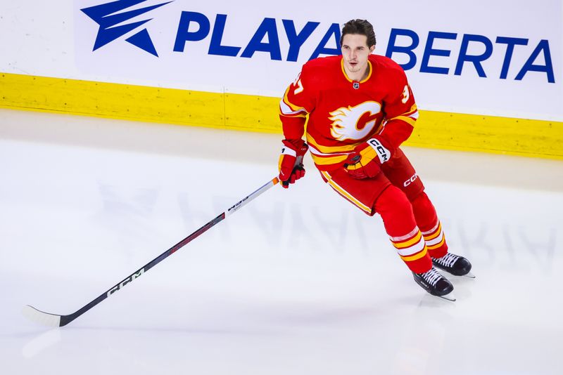 Jan 9, 2024; Calgary, Alberta, CAN; Calgary Flames defenseman Yan Kuznetsov (37) skates during the warmup period against the Ottawa Senators at Scotiabank Saddledome. Mandatory Credit: Sergei Belski-USA TODAY Sports