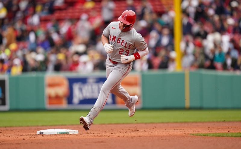 Apr 14, 2024; Boston, Massachusetts, USA; Los Angeles Angels second baseman Brandon Drury (23) hits a home run against the Boston Red Sox in the second inning at Fenway Park. Mandatory Credit: David Butler II-USA TODAY Sports