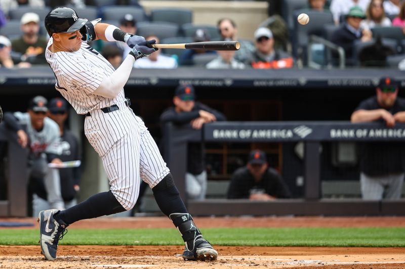 May 4, 2024; Bronx, New York, USA;  New York Yankees center fielder Aaron Judge (99) hits an RBI double in the third inning against the Detroit Tigers at Yankee Stadium. Mandatory Credit: Wendell Cruz-USA TODAY Sports