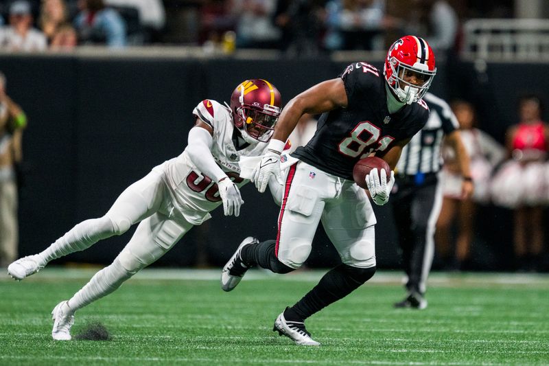 Atlanta Falcons tight end Jonnu Smith (81) runs the ball as Washington Commanders cornerback Danny Johnson (36) defends during the second half of an NFL football game, Sunday, Oct. 15, 2023, in Atlanta. The Washington Commanders won 24-16. (AP Photo/Danny Karnik)