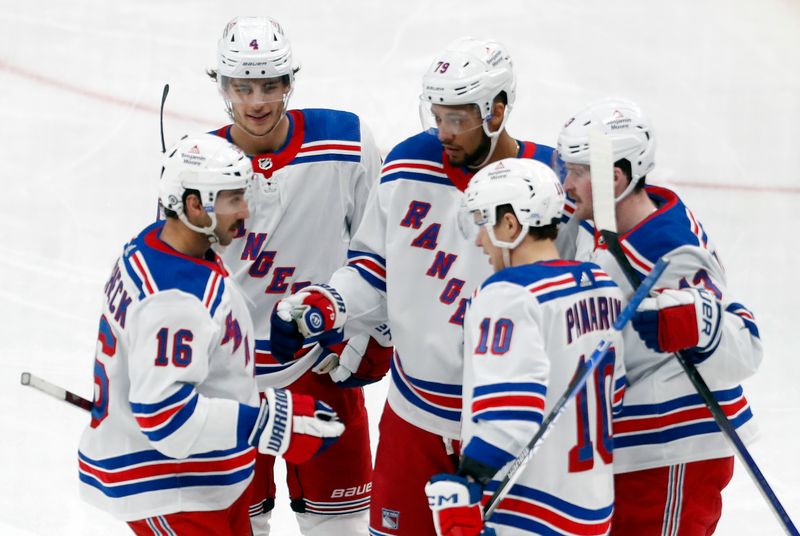 Mar 16, 2024; Pittsburgh, Pennsylvania, USA;  New York Rangers teammates congratulate defenseman K'Andre Miller (79 middle) after Miller scored a goal against the Pittsburgh Penguins during the third period at PPG Paints Arena. New York won 7-4. Mandatory Credit: Charles LeClaire-USA TODAY Sports