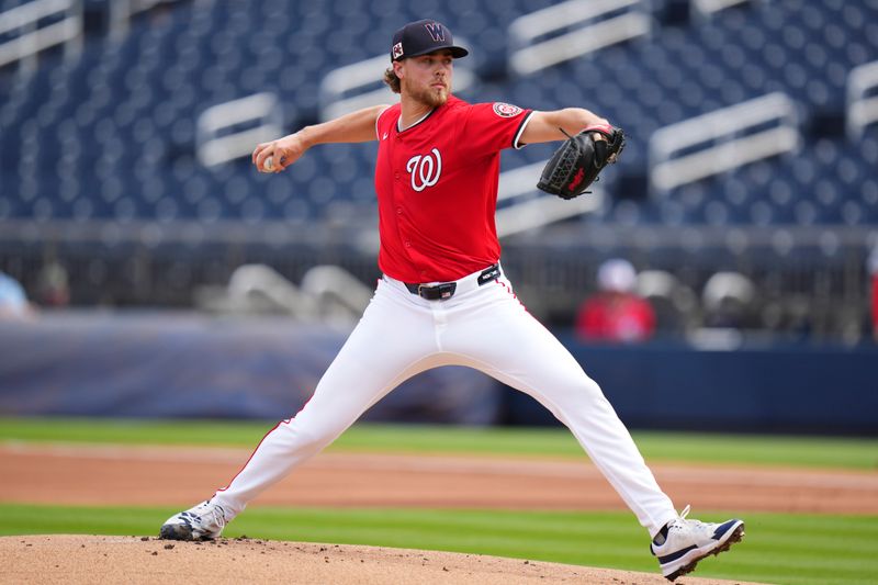 Mar 4, 2025; West Palm Beach, Florida, USA; Washington Nationals pitcher Jake Irvin (27) throws a pitch against the St. Louis Cardinals during the first inning at CACTI Park of the Palm Beaches. Mandatory Credit: Rich Storry-Imagn Images