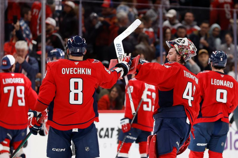 Nov 24, 2025; Washington, District of Columbia, USA; Washington Capitals left wing Alex Ovechkin (8) celebrates with Capitals goaltender Logan Thompson (48) after their game against the Columbus Blue Jackets at Capital One Arena. Mandatory Credit: Geoff Burke-Imagn Images