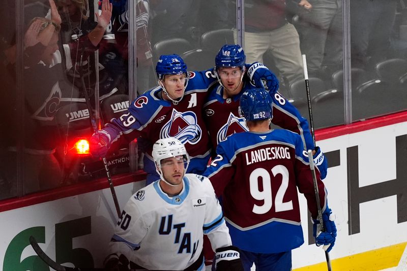 Oct 9, 2025; Denver, Colorado, USA; Colorado Avalanche center Nathan MacKinnon (29) celebrates his goal with center Martin Necas (88) and left wing Gabriel Landeskog (92) in the third period against the Utah Mammoth at Ball Arena. Mandatory Credit: Ron Chenoy-Imagn Images