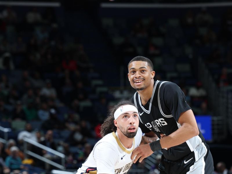 NEW ORLEANS, LA - FEBRUARY 25: Jose Alvarado #15 of the New Orleans Pelicans and Keldon Johnson #0 of the San Antonio Spurs looks on during the game on February 25, 2025 at the Smoothie King Center in New Orleans, Louisiana. NOTE TO USER: User expressly acknowledges and agrees that, by downloading and or using this Photograph, user is consenting to the terms and conditions of the Getty Images License Agreement. Mandatory Copyright Notice: Copyright 2025 NBAE (Photo by Jeff Haynes/NBAE via Getty Images)