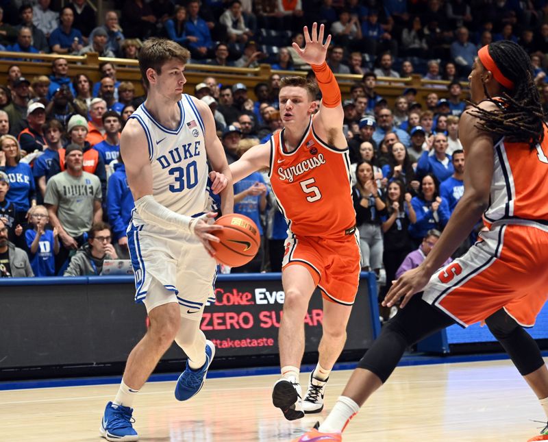 Jan 2, 2024; Durham, North Carolina, USA;  Duke Blue Devils center Kyle Filipowski (30) throws a pass in front of Syracuse Orange guard Justin Taylor (5) during the second half at Cameron Indoor Stadium.  The Blue Devils won 86-66. Mandatory Credit: Rob Kinnan-USA TODAY Sports