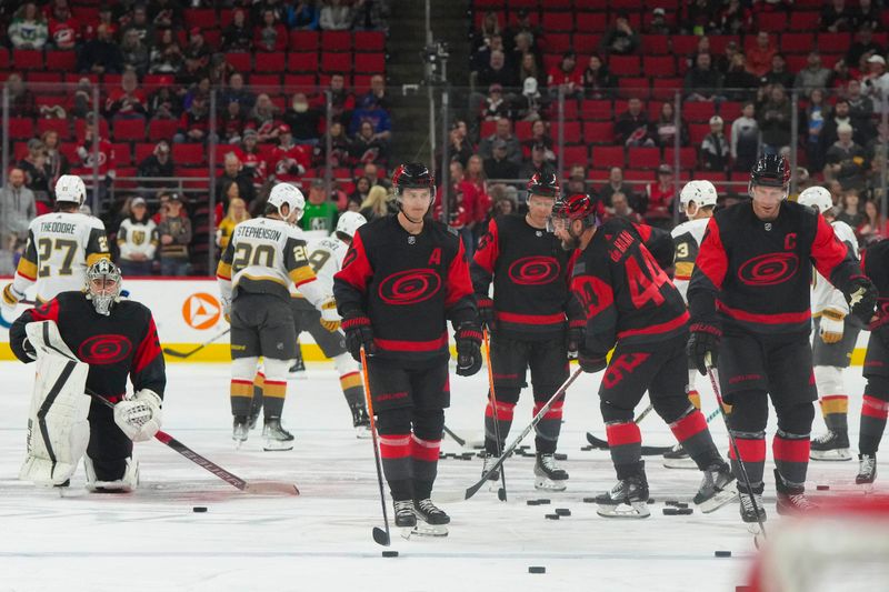 Mar 11, 2023; Raleigh, North Carolina, USA; Carolina Hurricanes center Sebastian Aho (20) center Jordan Staal (11) and goaltender Pyotr Kochetkov (52) look on before the game against the Vegas Golden Knights at PNC Arena. Mandatory Credit: James Guillory-USA TODAY Sports