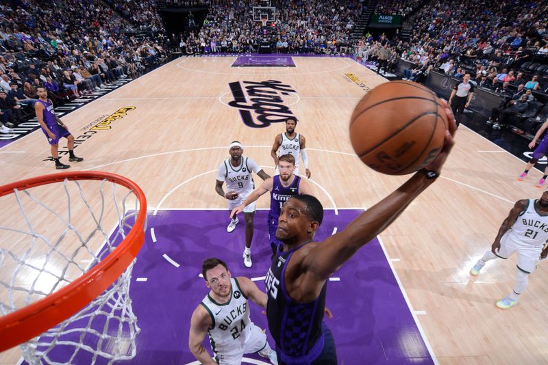 SACRAMENTO, CA - MARCH 12: De'Aaron Fox #5 of the Sacramento Kings drives to the basket during the game against the Milwaukee Bucks on March 12, 2024 at Golden 1 Center in Sacramento, California. NOTE TO USER: User expressly acknowledges and agrees that, by downloading and or using this Photograph, user is consenting to the terms and conditions of the Getty Images License Agreement. Mandatory Copyright Notice: Copyright 2024 NBAE (Photo by Rocky Widner/NBAE via Getty Images)